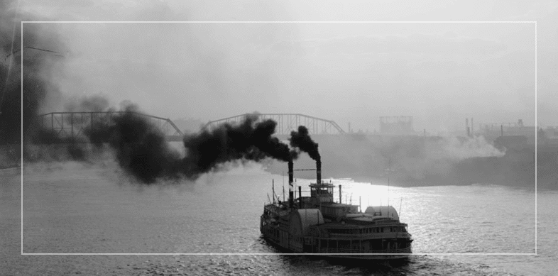 A boat with smoke coming out of it.