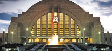 A large building with a clock on the front of it.