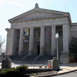 A large building with steps leading to the front.